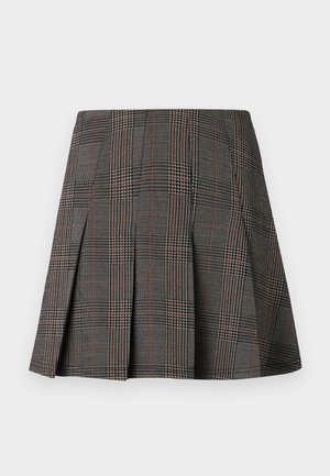 Gray plaid skirt featuring pleats, with intricate patterns of black and white, accented by thin red lines. Made from a structured fabric.