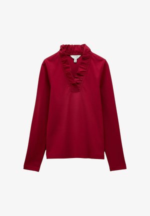 Ilgi piedurkņu tumši sarkans tops ar saplacinātu V veida apkakli, gludu audumu un taisnu apakšmalu.