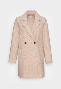 Beige kabát s dvojitým zapínáním, texturovaná látka, klopové límce, dvě přední kapsy a kulaté tmavé knoflíky.