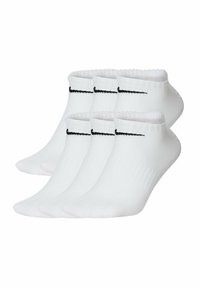 White ankle socks made from stretchy material, featuring a black Nike logo on the side. Pack of five with ribbed cuffs for secure fit.
