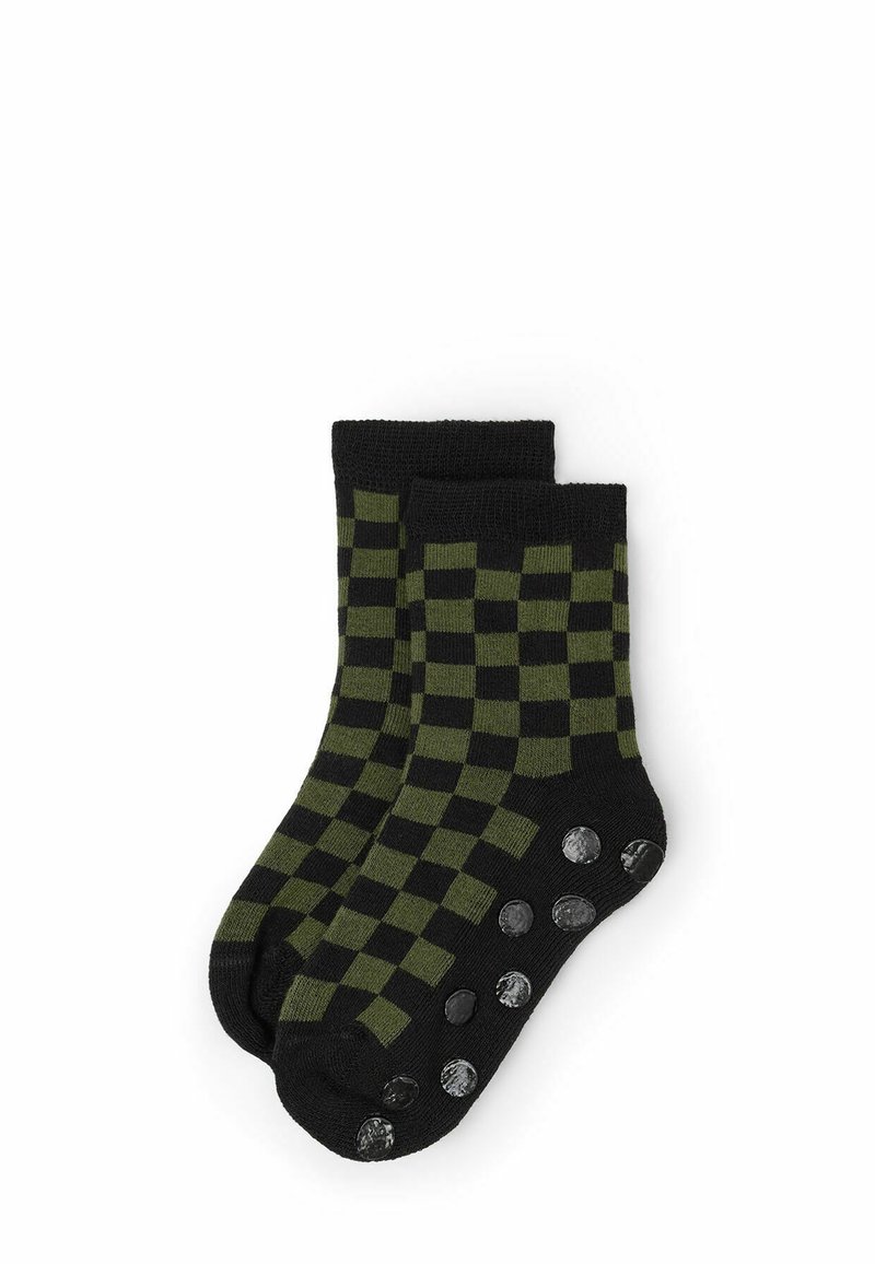 Schwarz- und olivgrüne Karosocken mit gestrickter Textur und Griffpunkten an der Sohle für Traktion und Stabilität.