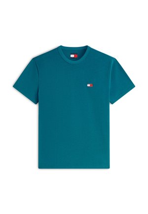 T-shirt à manches courtes couleur sarcelle avec col rond, petit écusson logo Tommy Jeans sur le côté gauche de la poitrine et à l'intérieur du col.