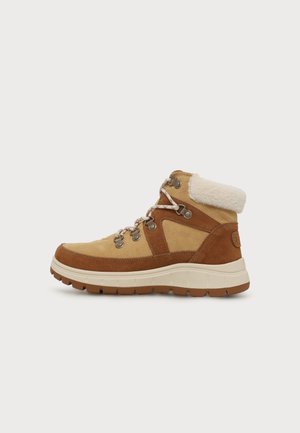 Botte d’hiver marron et beige à lacets avec col en polaire blanc et semelle en caoutchouc épaisse, vue de côté droit sur fond blanc.