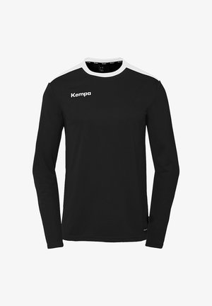 Sort langærmet sportsbluse med hvide skulderaccentuer. Fremstillet af letvægtsstof, har rund halsudskæring og "Kempa" logo på brystet.