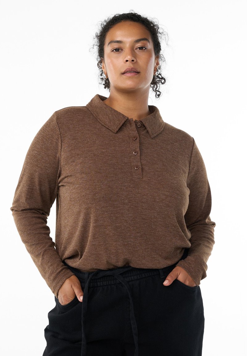 Brown long-sleeve polo shirt with a collar, featuring a button placket and textured fabric, paired with black drawstring pants.