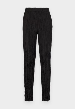 Black pants with a crinkled texture, elastic waistband, and tapered leg design. No visible pockets or distinctive accents.