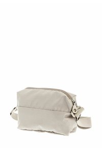 Sac bandoulière en tissu beige avec une surface texturée, doté d'une fermeture éclair et d'une sangle réglable. Forme rectangulaire compacte.