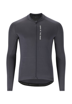 Långärmad cykeltröja i mörkgrått med dragkedja framtill. Har texten "HERO OF THE ROAD" och "ENDURANCE"-logotypen på fållen. Slät textur.