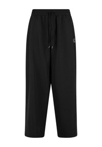 Crne dukserice s elastičnim pojasom i vezicom. Napravljene od mekanog materijala, s opuštenim krojem i bočnim džepovima.