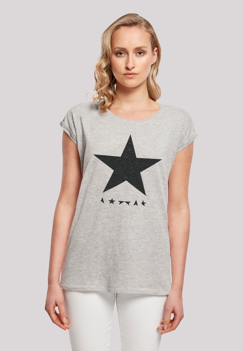 Gray cotton t-shirt with rolled short sleeves, featuring a large black star print and small black stars below it.