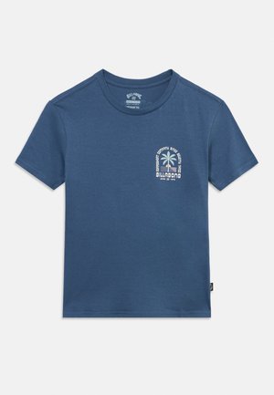 Blue short-sleeve crew neck T-shirt with small front left chest graphic of a palm tree and "Billabong" text.