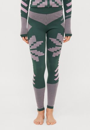Groene leggings met roze geometrische patronen en gestreepte accenten. Gemaakt van textuurstof, met een aansluitend ontwerp en enkelmanchetten.
