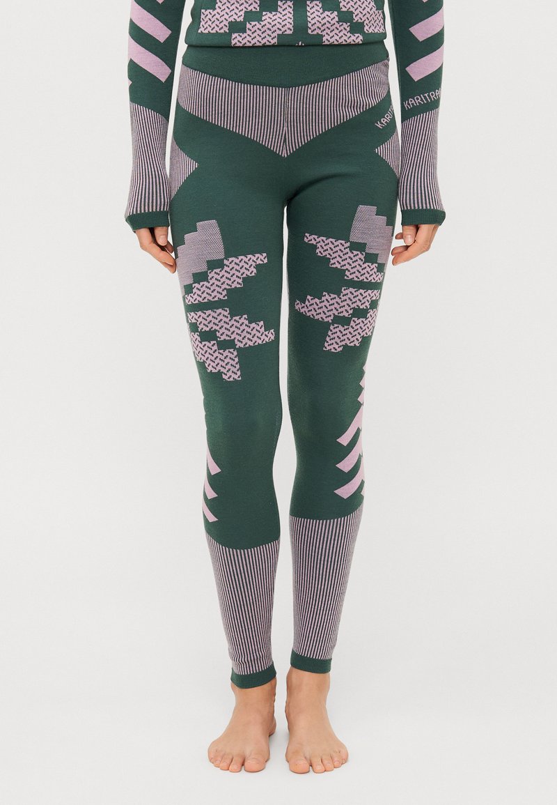 Grønne leggings med rosa geometriske mønstre og stripete detaljer. Laget av teksturert materiale, har en tettsittende design og ankelmanchetter.