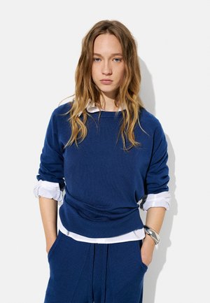 - Sweter