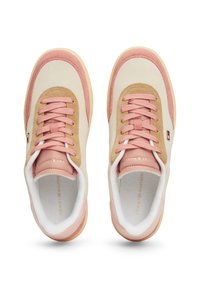 Pink and tan sneakers with suede and leather materials, featuring round laces, a padded collar, and a logo on the side.