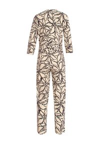 Jumpsuit van crème stof met een zwart en teal bladpatroon. Het heeft lange mouwen en een relaxed fit, met een gladde textuur overal.
