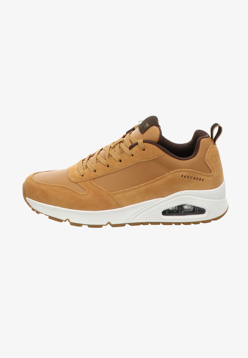 Tan athletic sneaker with a suede and synthetic upper, rubber outsole, lace-up design, and visible air cushioning in the sole.