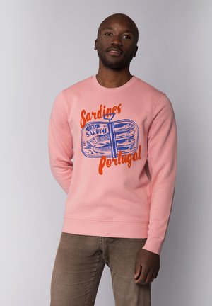 Pink cotton sweatshirt featuring blue and orange sardine graphics, round neckline, and ribbed cuffs and hem. Smooth texture with a casual fit.