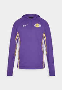 Lila langärmliger Kapuzenpullover mit gelben Seitenstreifen und einem Lakers-Logo, halb gebrochenem Reißverschluss-Kragen und einer Textur für Atmungsaktivität.