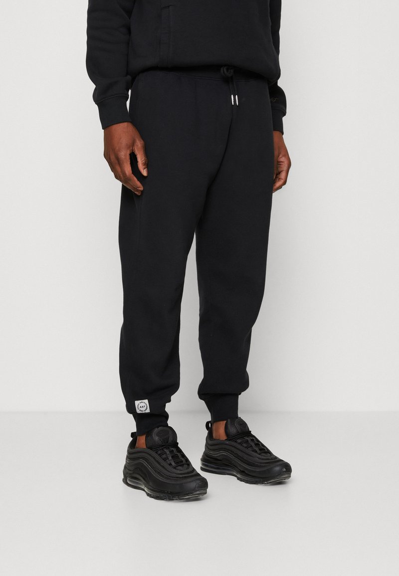 Abercrombie & Fitch - MICROSCALE TREND LOGO JOGGER - Pantalones deportivos - casual black, Ampliar