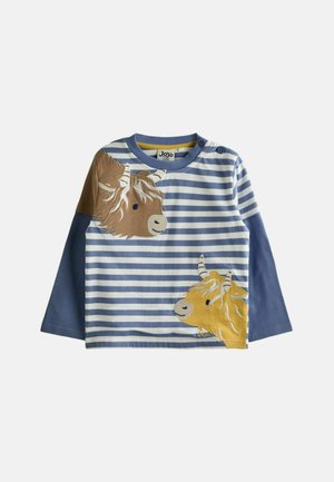 Hosszú ujjú kék és fehér csíkos ing, barna és sárga állatfej appliquékkel. Pamut anyag, kerek nyakkivágással és gombos részlettel.