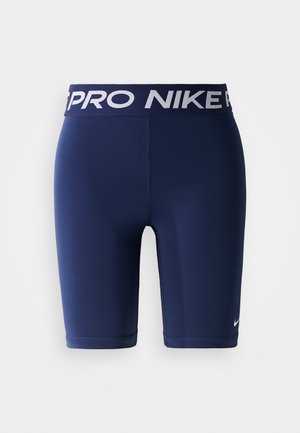 Mørkeblå Nike Pro kompresjonsshorts med elastisk midjebånd som har hvit Nike Pro branding og en liten hvit Nike swoosh på benet.