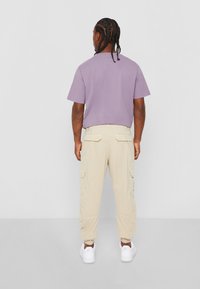 Urban Classics CARGO JOGGING PANTS - Cargo trousers - sand