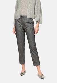 Gray striped trousers made from a lightweight fabric, featuring a button closure, rolled cuffs, and a tailored fit. Paired with soft gray cardigan.