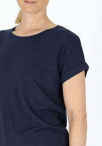 Navy blue short-sleeve t-shirt with a round neckline and rolled sleeves, made of soft fabric with a smooth texture.