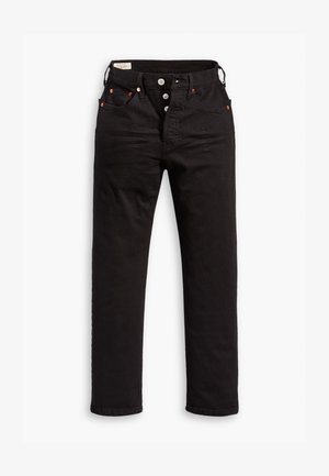 Black straight-leg jeans with button fly, front and back pockets, and copper rivet details on a white background.