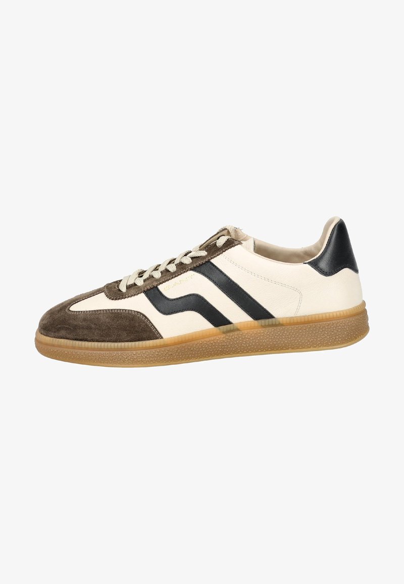Sneakers featuring a cream leather upper, brown suede toe, and black striped accents. Textured rubber sole with a gum color. Flat laces.