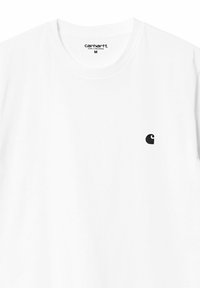 White cotton t-shirt with a rounded neckline, short sleeves, and a small black embroidered logo on the left chest. Size M.