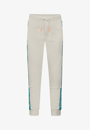 Beige joggingbroek met aqua blinde strepen en tekst. Gemaakt van zacht materiaal, heeft een elastische tailleband met een trekkoord en geribbelde manchetten.