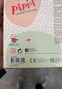 Pippi Longstocking box features pastel colors, playful polka dots, and illustrations; includes branding from Micki and Astrid Lindgren Company.