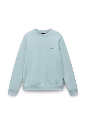 Jasnoniebieska bluza z okrągłym dekoltem i długimi rękawami. Posiada ściągacze przy rękawach i u dołu. Małe logo na piersi. Gładka, miękka tekstura.