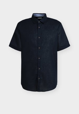 Marineblå kortærmet skjorte med knapper, spids krave, syv knapper og lige kant mod en ensfarvet baggrund.