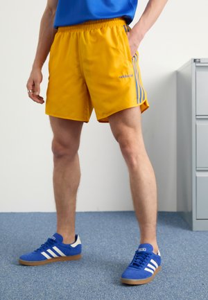 adidas Originals FOOTBALL - Tracksuit bottoms - crew yellow