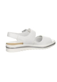 White leather sandal with an open toe, adjustable strap, contoured footbed, and a cushioned sole featuring a silver accent stripe.