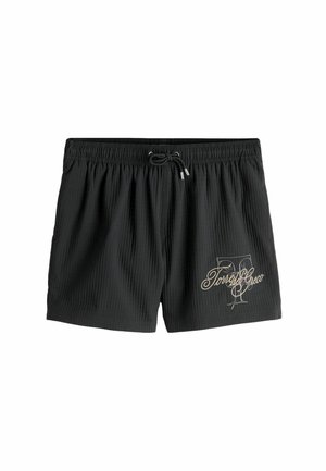 Costume da bagno da uomo nero con vita elastica e coulisse, caratterizzato dalla scritta "Torre del Greco" e da una grafica sulla gamba sinistra.