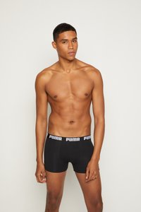 Black boxer briefs with a white Puma logo on the waistband. The fabric appears smooth and stretchy, designed for comfort and fit.