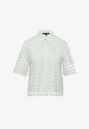 White short-sleeve shirt with a lace-like diamond pattern, button-front placket, and scalloped hem. Made of textured fabric.