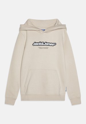 Beige kapuce, kas izgatavota no kokvilnas maisījuma, ar lielu logotipu priekšpusē, priekšējo kabatu un ribotām aprocēm un apakšmalu.