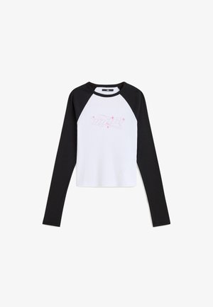 Long-sleeve raglan t-shirt with white body and black sleeves. Features a pink graphic design on the front. Made from soft cotton material.