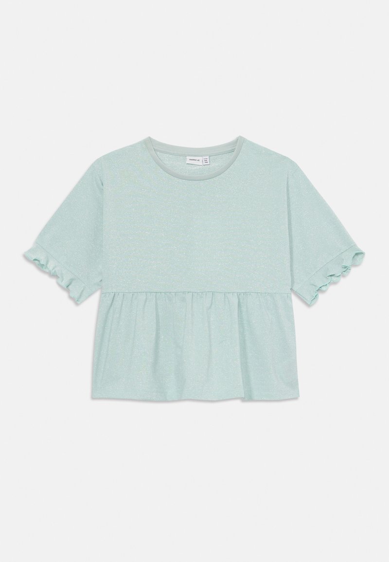 Mėtų žalios spalvos trumpomis rankovėmis palaidinė su peplum dizainu, turinti tekstūruotą paviršių ir raukiniais aptrauktas rankoves.