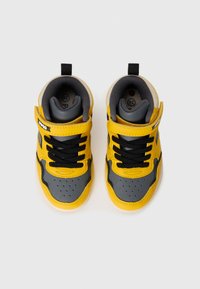 High-top sneakers in yellow and gray leather with black laces. Features a velcro strap, perforated toe, and cushioned gray inner lining.