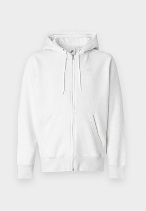 Witte hoodie met ritssluiting, gemaakt van een zachte stof met een buidelzak, trekkoorden en een klein logo op het bovenste linkerborstgedeelte.