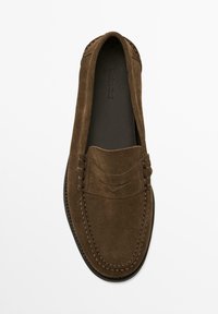 Brown suede loafer featuring a smooth texture, a rounded toe, and decorative stitching on the vamp. Minimalist design with no visible hardware.