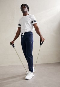 Champion ICON PANTS - Tepláky - navy