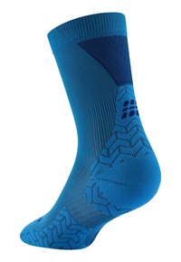 Calzino blu alla caviglia con motivi testurizzati, dotato di polsino a coste e tallone rinforzato. Realizzato in tessuto traspirante con una vestibilità aderente.