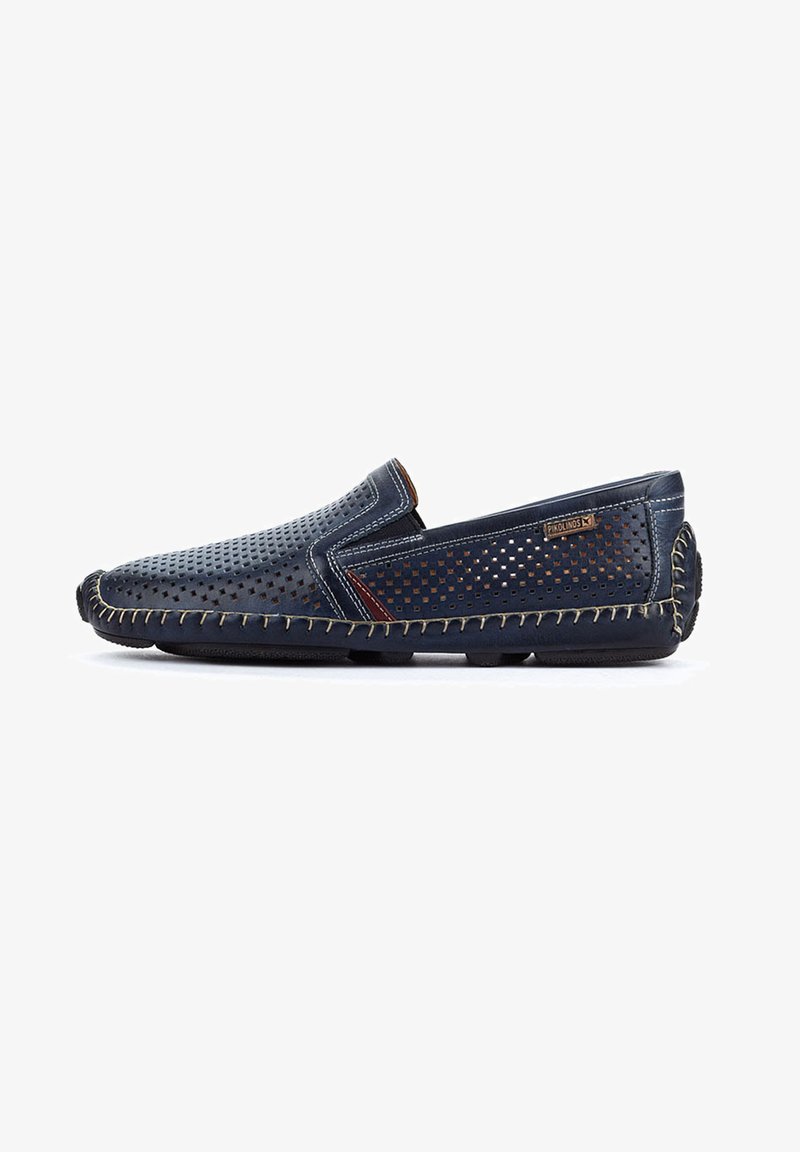 Navy blue slip-on shoes with perforated leather, contrasting stitched detailing, and a leather accent on the side. Rubber outsole for grip.